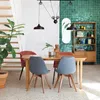 A dining room with a table, chairs, and a bookshelf. Anteprima dell’immagine prodotto