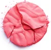 A broken round pink powder blush on a white background. Podgląd zdjęcia produktu