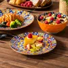 A table setting with plates of food and a bowl of cereal. Náhled obrázku produktu