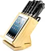 A wooden knife block with an iPad inserted into a slot, holding several knives. Náhľad obrázku produktu