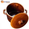 A brown ceramic pot with a lid, shown from a slightly elevated angle against a white background. The lid is partially open, revealing the inside of the pot. A logo and text are visible in the top left corner. Voir les images du produit
