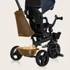 A close-up view of a child's tricycle, highlighting its features. Podgląd zdjęcia produktu