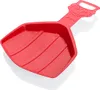 A red plastic snow shovel with a cartoon face on the handle. Voir les images du produit