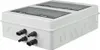 A white junction box with two transparent covers and several black connectors on the side, set against a white background. Náhled obrázku produktu