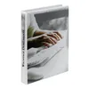 A binder with a picture of hands typing on a keyboard. Voir les images du produit