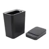 A black automatic trash can and its lid are shown against a white background. Náhled obrázku produktu
