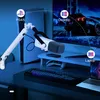 A white microphone with a boom arm is shown on a desk, connected to a PS5, a desktop monitor, and a laptop, illustrating its versatility for gaming and streaming. Anteprima dell’immagine prodotto