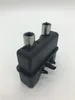 A black coffee machine part with two silver nozzles on a white background. Produktbild-Vorschau