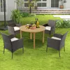 A patio dining set with four chairs and a round table is set up on a green lawn in front of a house. Podgląd zdjęcia produktu