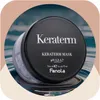 A black jar of Fanola Keraterm Mask sits on a reflective surface, possibly water, with a blurred background. Náhled obrázku produktu