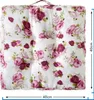 A square cushion with a floral pattern of roses on a white background. Produktbild-Vorschau