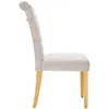 Side view of a beige upholstered dining chair with wooden legs. Produktbild-Vorschau