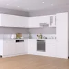 A clean, modern white kitchen with cabinets, appliances, and a sink. Voir les images du produit