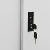 A close-up of a lock and key on a white surface. Produktbild-Vorschau