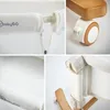 Collage of close-up shots of a baby crib, showing details of its construction, mattress, and wheels. Produktbild-Vorschau