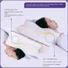 Two people sleeping on a white ergonomic pillow, with diagrams indicating different height zones. Produktbild-Vorschau
