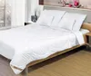 A neatly made bed with white bedding and pillows, set in a bedroom with a window and wooden furniture. Podgląd zdjęcia produktu