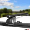 Close-up of a black roof rack on a white car, with a blurred background of trees and sky. Podgląd zdjęcia produktu