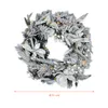Couronne de sapin avec neige et fleurs blanches - illuminée Voir les images du produit 2