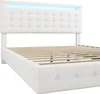 A white upholstered bed frame with a tufted headboard and integrated LED lighting. Produktbild-Vorschau