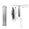 A silver cylindrical object and a silver tripod drying rack with clothes hanging on it, both on a white background. Produktbild-Vorschau