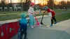 Three children are at a skate park with their scooters. Náhľad obrázku produktu