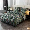 A bedroom scene with a bed dressed in floral bedding. Náhľad obrázku produktu