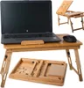 A laptop on a bamboo desk with a mouse, and a folded bamboo tray underneath. Another smaller bamboo laptop desk is shown in the background. Náhľad obrázku produktu