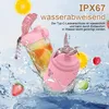 Two pink portable blenders are shown with water splashing around them, along with various fruits like strawberries, oranges, and limes. The scene is set against a light blue and white background. Produktbild-Vorschau