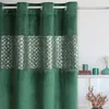 A close-up of a green curtain with a silver decorative band. Produktbild-Vorschau