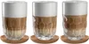Three glasses of latte macchiato on cork coasters. Anteprima dell’immagine prodotto