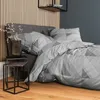 A bedroom scene with a bed, nightstand, and wall paneling. Produktbild-Vorschau