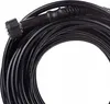 A coiled black hose with a connector at one end, against a white background. Voir les images du produit