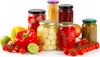 A collection of preserved fruits and vegetables in jars, along with fresh produce like bell peppers, strawberries, tomatoes, and limes, arranged on a white background. Podgląd zdjęcia produktu