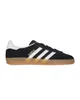 A black Adidas Gazelle sneaker with white stripes and a tan sole is shown against a white background. Produktbild-Vorschau