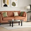 A living room scene with a brown leather couch, coffee table, and floor lamp. Náhľad obrázku produktu