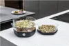 Two sprouters filled with sprouts on a kitchen counter. Produktbild-Vorschau