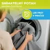 A person is putting a gray blanket or cushion into a washing machine. Náhled obrázku produktu