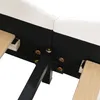 A close-up view of the underside of a white upholstered bed frame, showing the black metal support structure and wooden slats. Produktbild-Vorschau