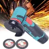 A person is using a cordless angle grinder with sparks flying in the background. Two grinding discs are shown in the foreground. Náhled obrázku produktu