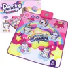 A product box and a dancing mat with unicorns and rainbows. Produktbild-Vorschau