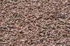 A close-up, overhead view of a pile of small, reddish-brown granite gravel. Produktbild-Vorschau