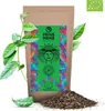 A bag of organic guayusa tea with some leaves and a pile of tea leaves in front of it. Náhled obrázku produktu