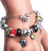 A close-up shot of a charm bracelet with various Halloween-themed charms on a mannequin's wrist. Produktbild-Vorschau