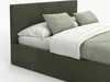 A close-up view of a bed with a headboard, mattress, pillows, and a blanket. Náhled obrázku produktu