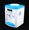 A white and blue water dispenser is shown against a black background. Náhled obrázku produktu