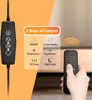 A close-up of a remote control and a control panel for a lamp, with text overlays explaining features. Produktbild-Vorschau