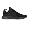 A studio shot of a black Adidas sneaker. Podgląd zdjęcia produktu