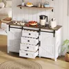 A white sideboard with sliding barn doors and four open drawers, displaying kitchen items like a kettle, toaster, strawberries, and pastries. Voir les images du produit