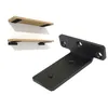 A black metal shelf bracket is shown next to two wooden shelves with black brackets attached. Produktbild-Vorschau